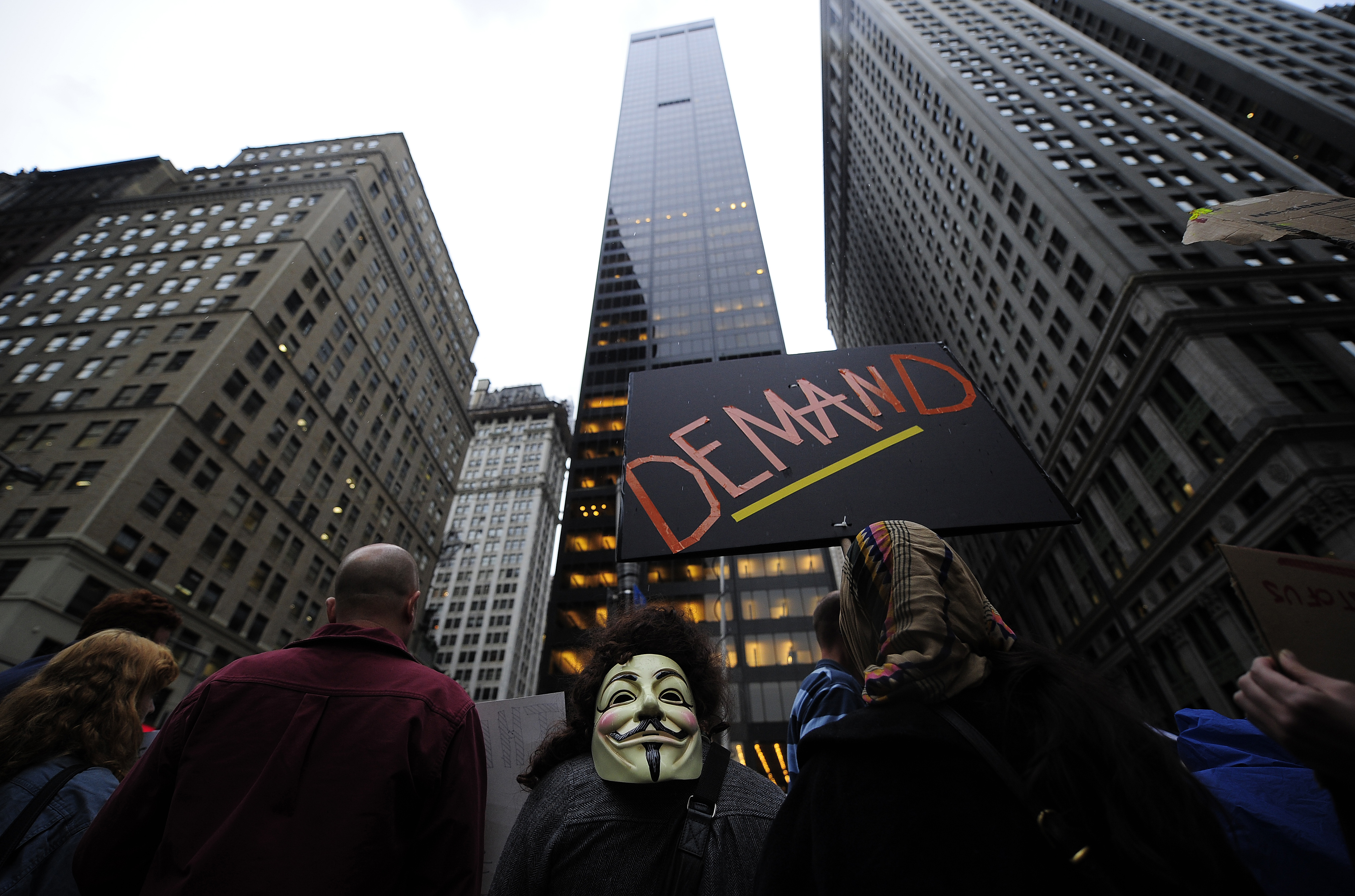 "Occupy Wall Street" demonstrator stage a protest near Wall Street in New York, October 3, 2011. The protestors, speaking out against corporate greed and other issues carried on their occupation of Zuccotti Park, near the New York Stock Exchange, despite mass arrests over the weekend. AFP PHOTO/Emmanuel Dunand (Photo credit should read EMMANUEL DUNAND/AFP/Getty Images)