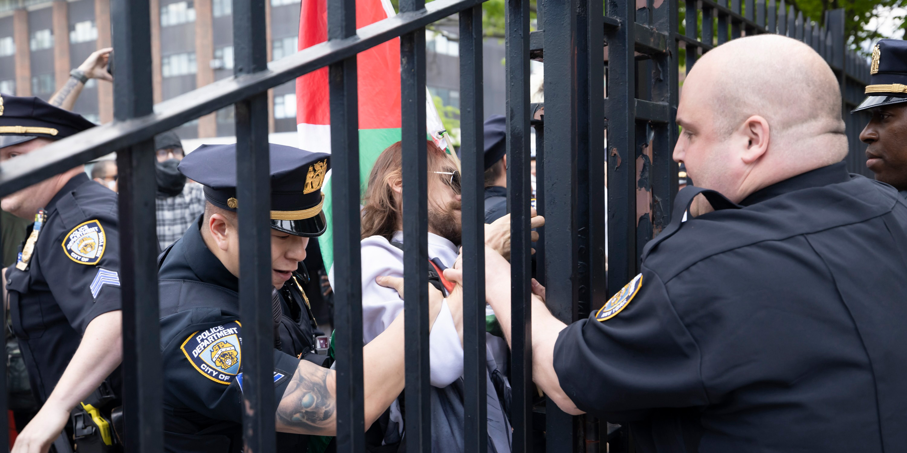 Police arrest a protester outside the campus gates of Brooklyn College during a student-led protest against the ongoing war in Gaza on May 8, 2025 in Brooklyn, New York.