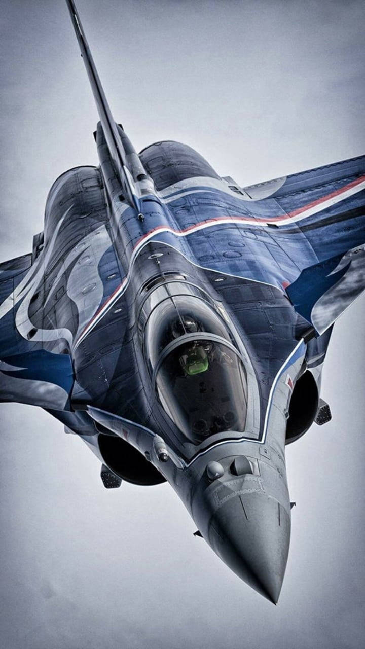 Majestic Dark Blue Fighter Jet in Flight Wallpaper