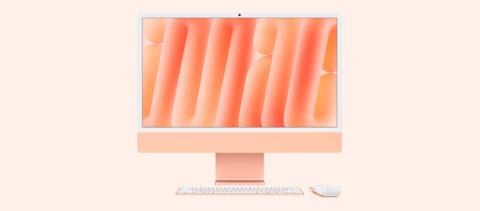 Помаранчевий iMac з мишею та клавіатурою в тон, вид спереду