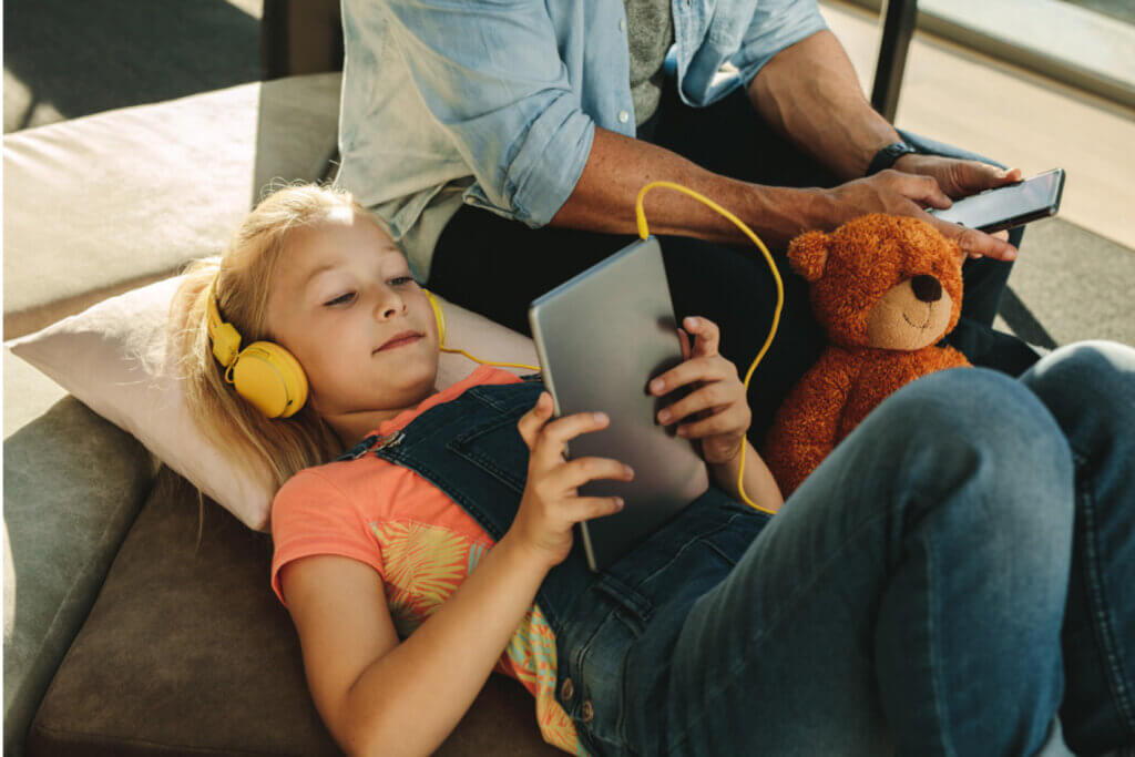 Girl on tablet with her father