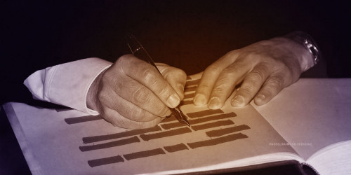 ICAAN Censor Person in suit censoring words on a page