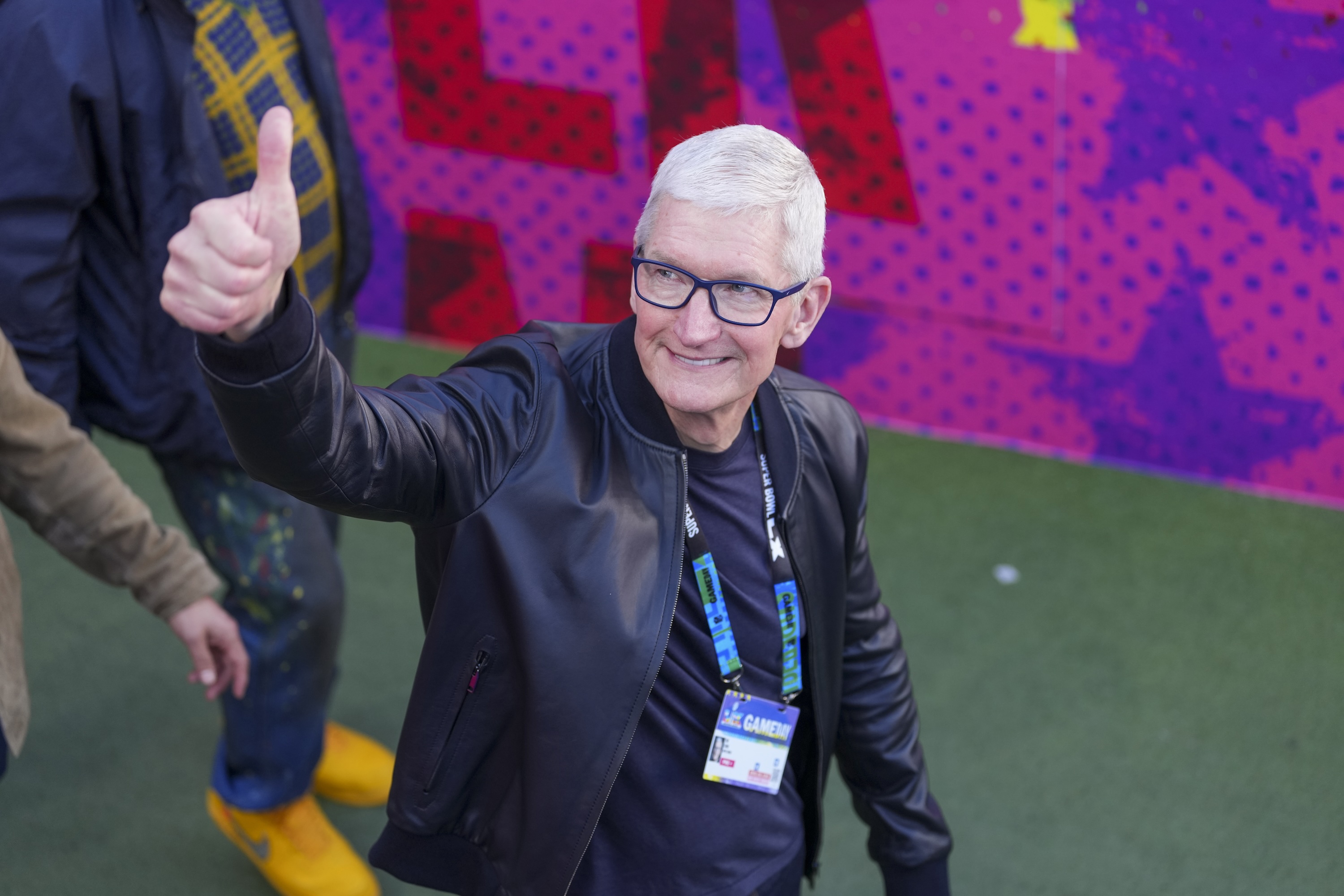 SANTA CLARA, CALIFORNIA - FEBRUARY 8: CEO of Apple Inc. Tim Cook walks up before the NFL Super Bowl LX football game between the Seattle Seahawks and New England Patriots at Levi's Stadium on February 8, 2026 in Santa Clara, California. (Photo by Perry Knotts/Getty Images)
