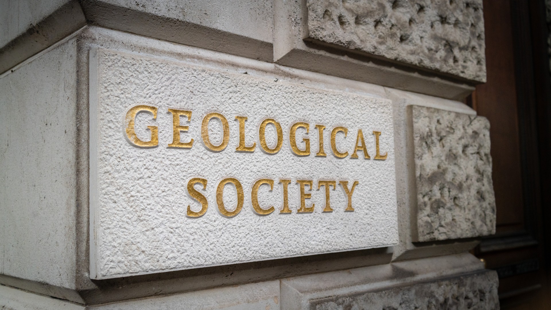 geological society written on a stone plaque