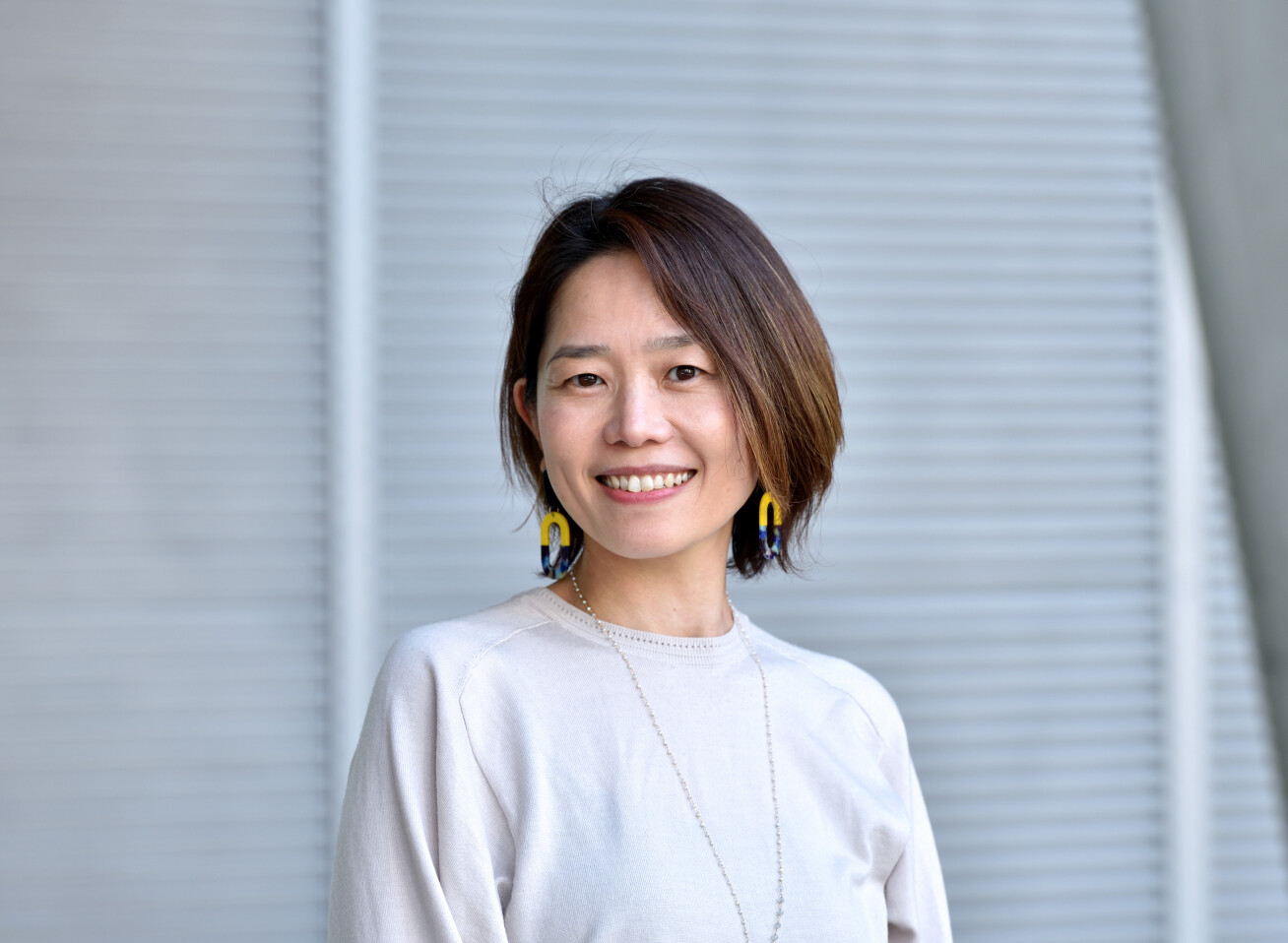 Atsuko Campbell smiling at camera for portrait