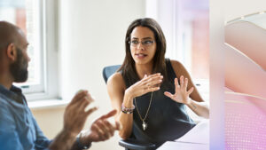 A decorative image of two financial services professionals working together