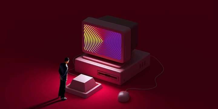 A miniature person looking at a big keyboard key and a hypnotizing computer screen