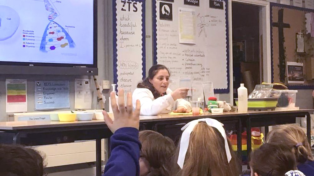 A scientist giving a demonstration at a primary school.