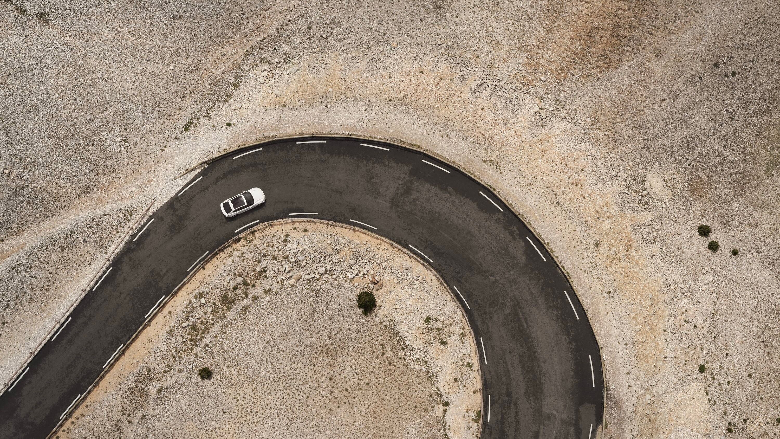 Aerial view of Polestar taking tight corner