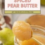 A spoonful of spiced pear butter held above a glass jar, with whole pears and a jar lid in the background. Text overlay reads: "Spiced Pear Butter.