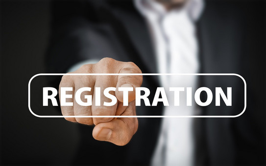 Registrierung Eine Person zeigt mit dem Zeigefinger auf den Schriftzug "Registration".