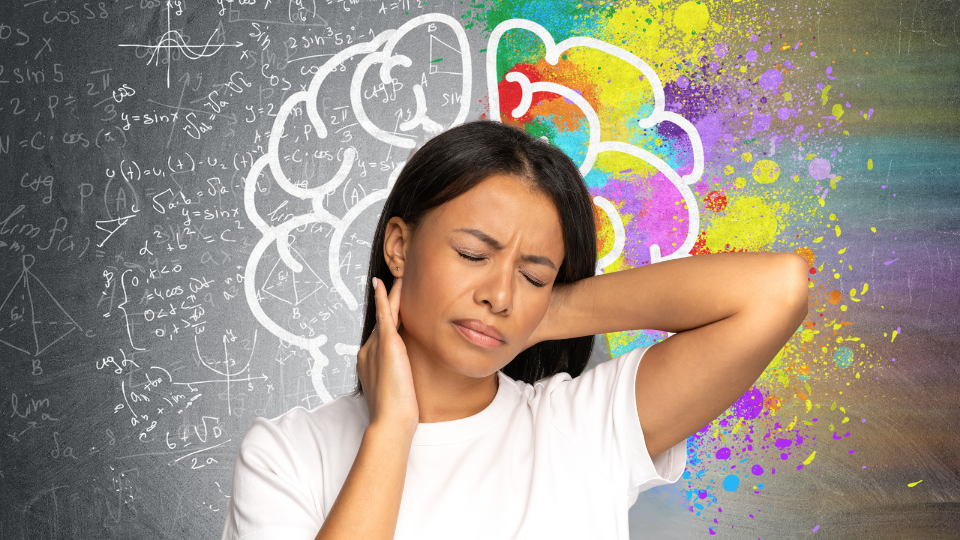 Woman with visual stress holding back of her head